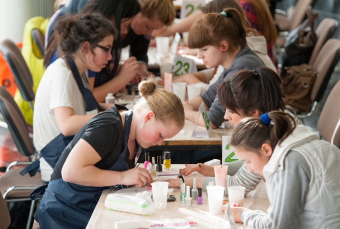 Students learning how to do manicures